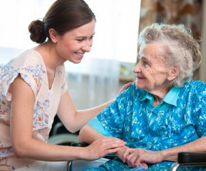 senior woman with her home caregiver
